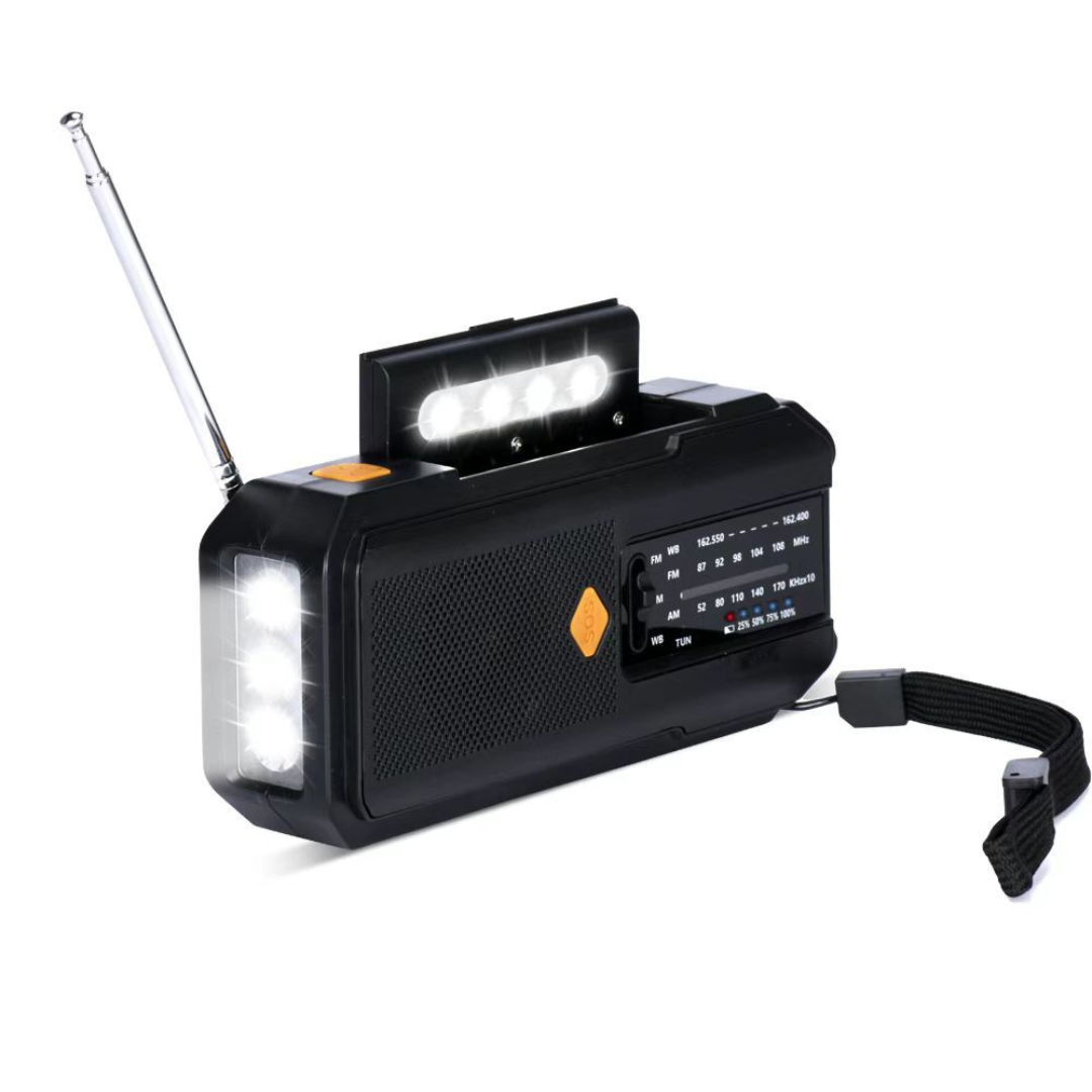 Hand crank emergency weather radio with solar panel charging in outdoor survival gear