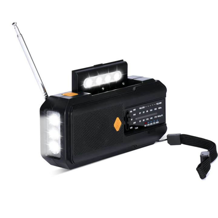 Hand crank emergency weather radio with solar panel charging in outdoor survival gear