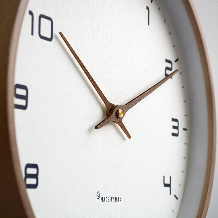 Detailed shot of the clock face showing numbers and silent sweep hands.