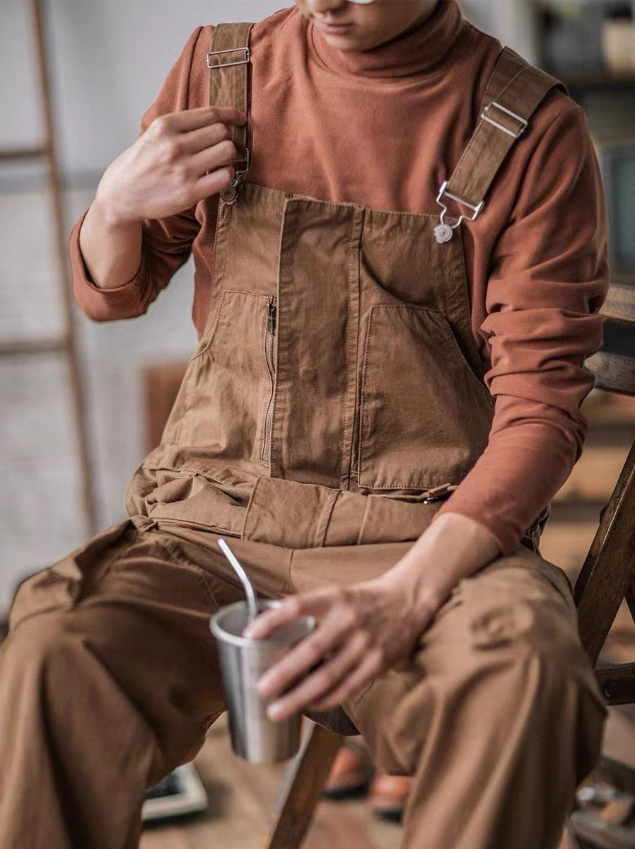 Men's casual fashion utility overalls styled with a basic t-shirt