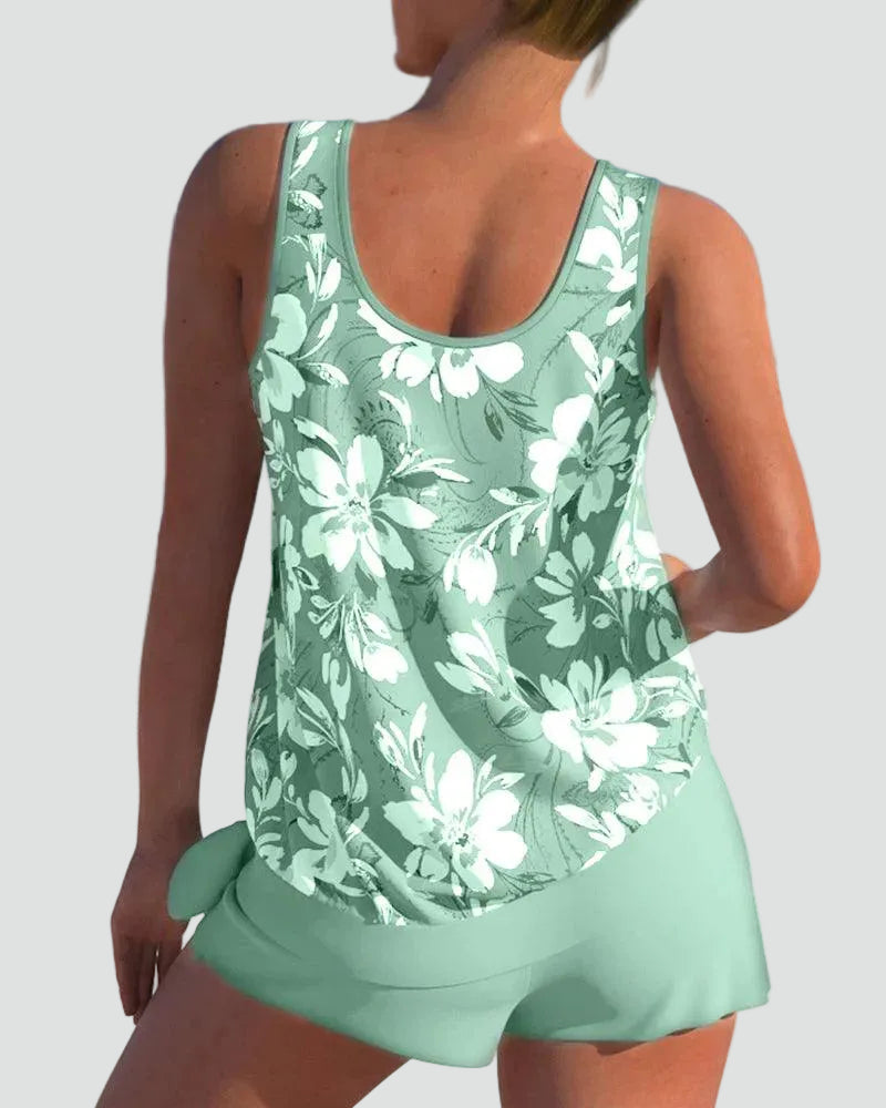 Close-up fabric detail of the womens floral print swimwear showing vibrant colors and stretch material