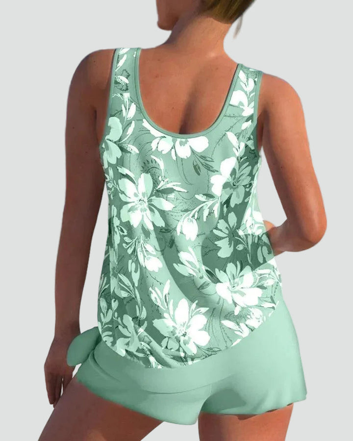 Close-up fabric detail of the womens floral print swimwear showing vibrant colors and stretch material