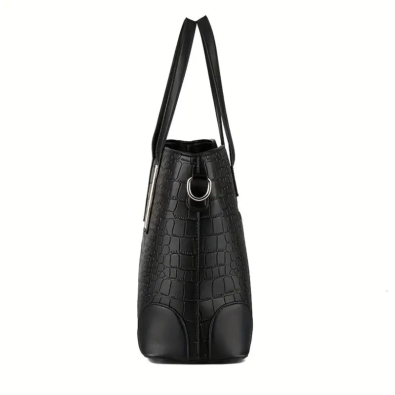 Close-up of the premium material texture and stitching on the black luxury shoulder bag.