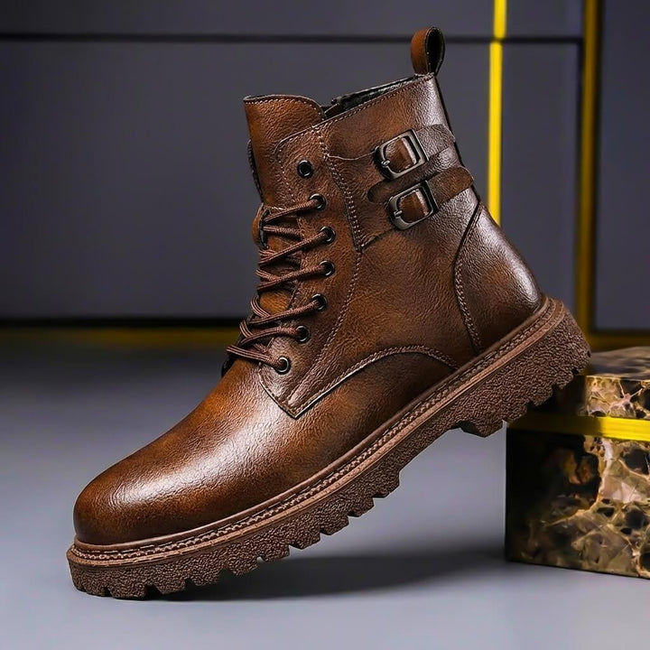 Side profile of brown men's vintage ankle boots with buckle detail