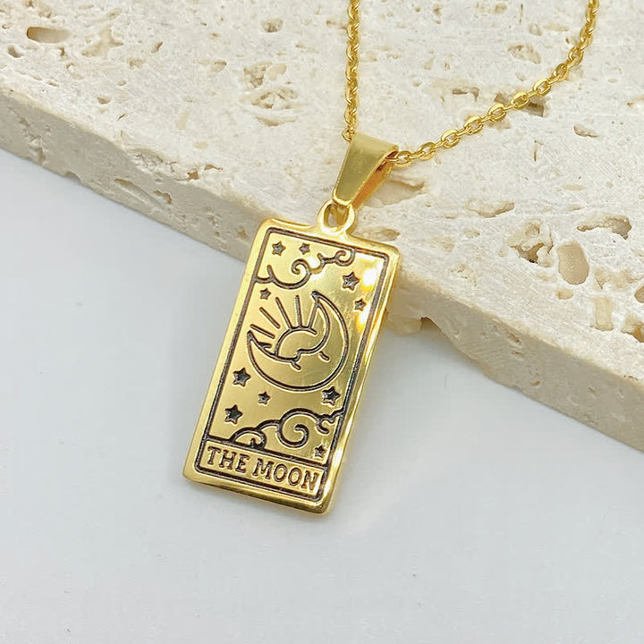 Detailed view of tarot card pendant on stylish gold chain necklace