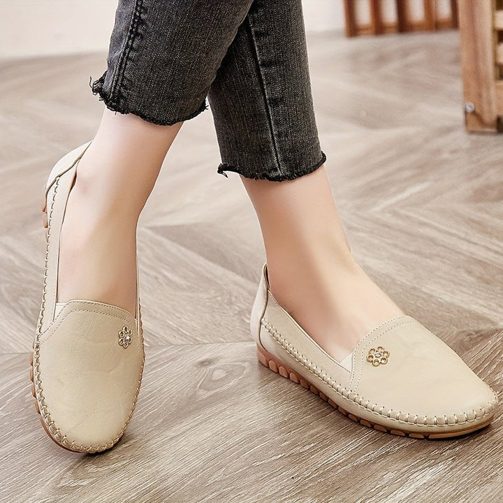 Bottom sole view of the lightweight slip-on loafers, showing traction pattern and flexible construction.