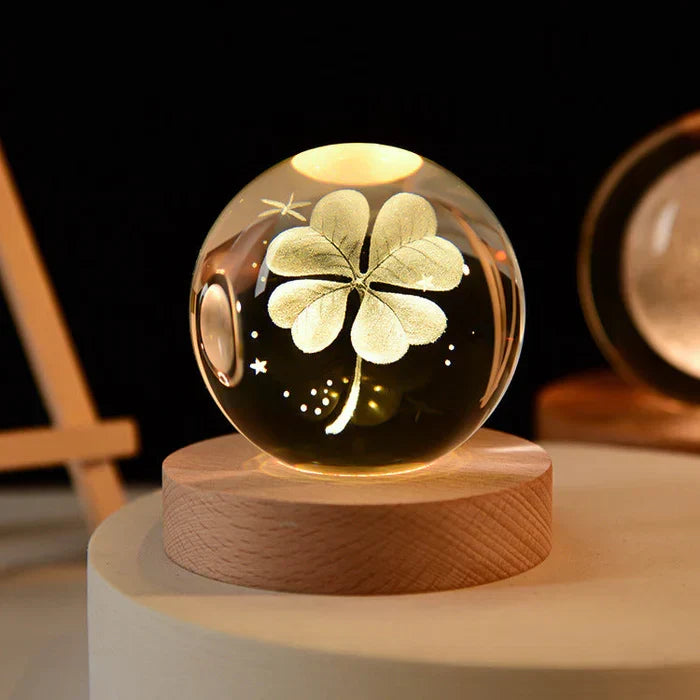 Four-leaf clover 3D crystal night light illuminating a wooden stand