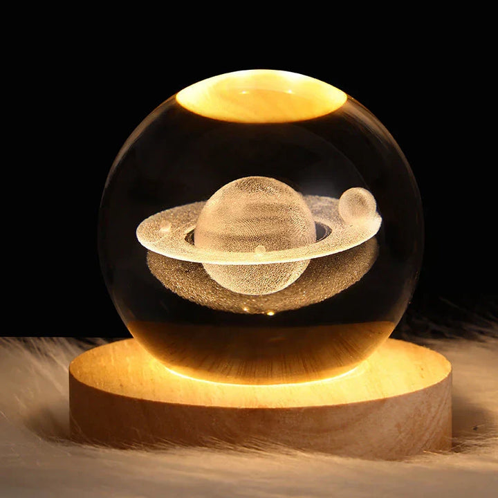 Close-up of engraved crystal ball mood lighting with warm LED wood stand