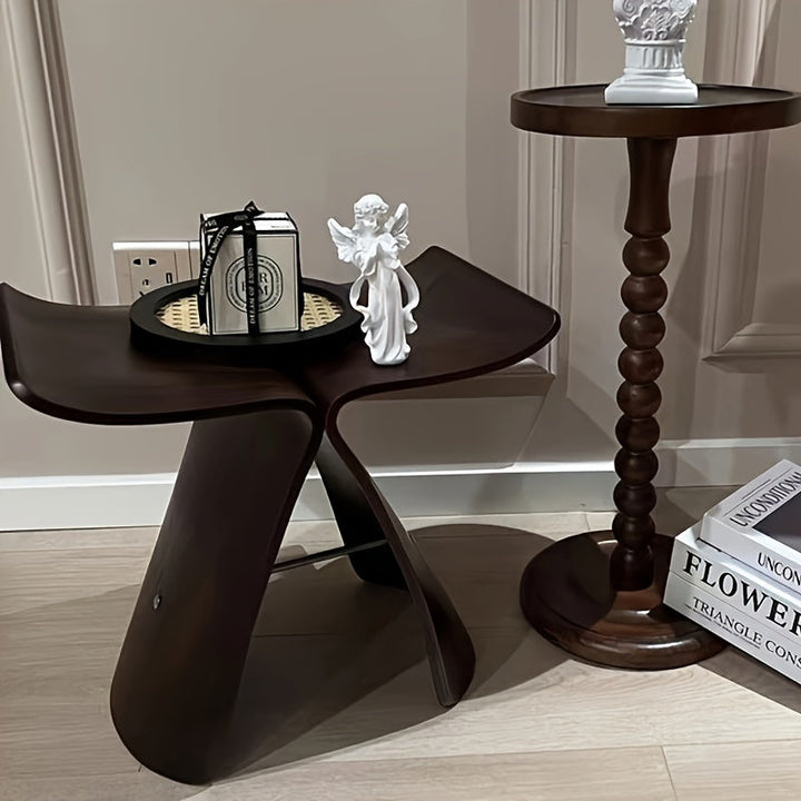 Minimalist wooden furniture piece styled as a chic seating accent in an entryway