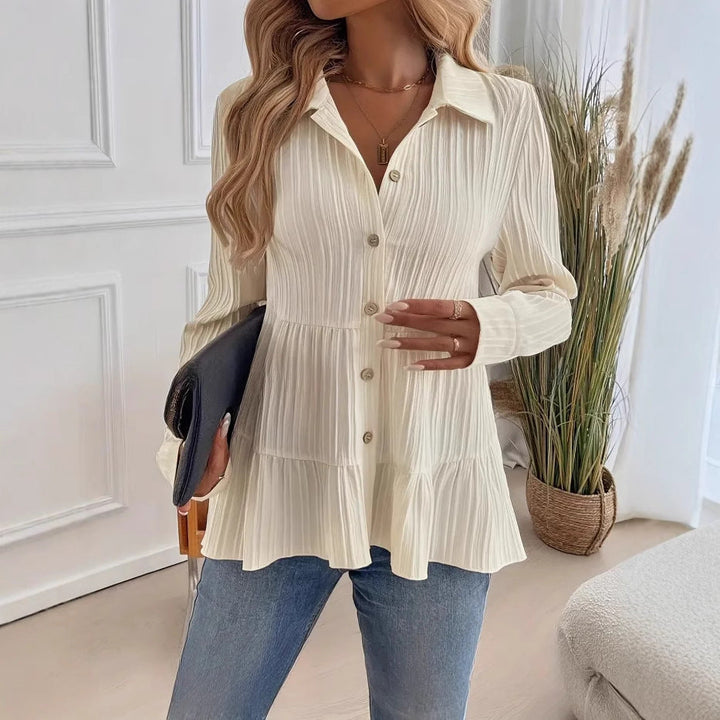Close-up view of the beige pullover shirt with button details