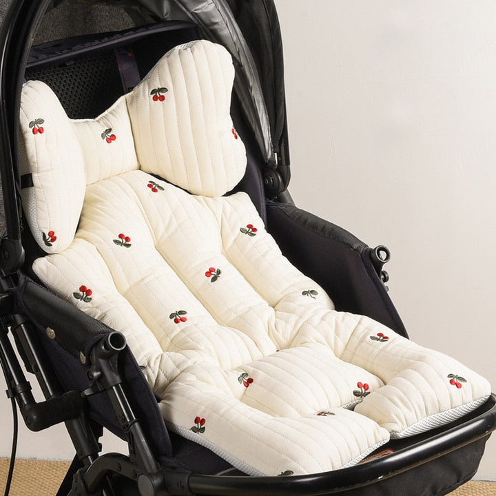 Padded pram seat liner showing superior thickness and edge stitching
