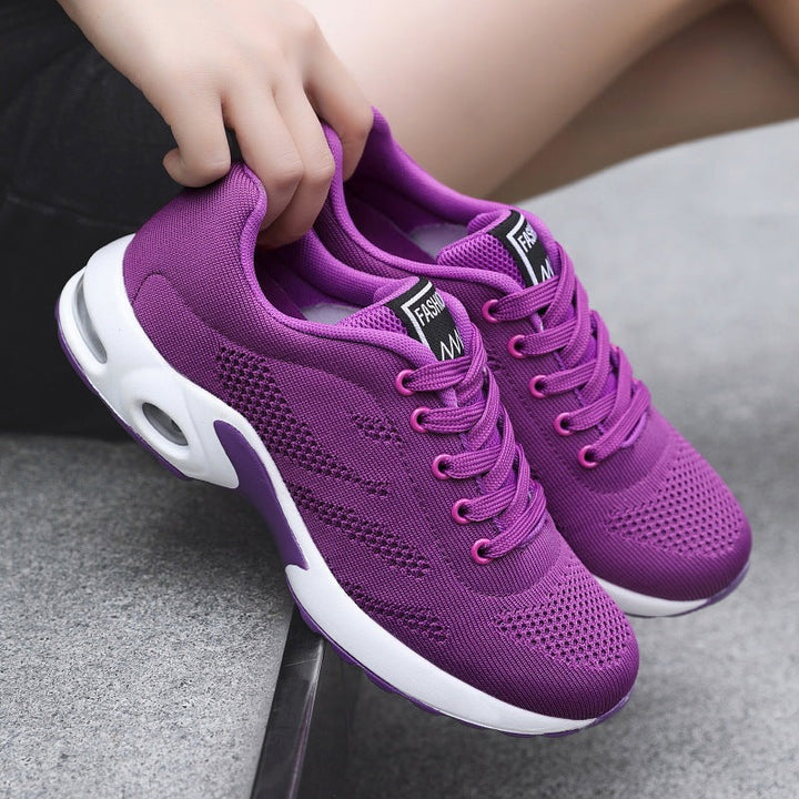 Detailed shot of breathable mesh texture on white orthopedic slip-on shoes for women.