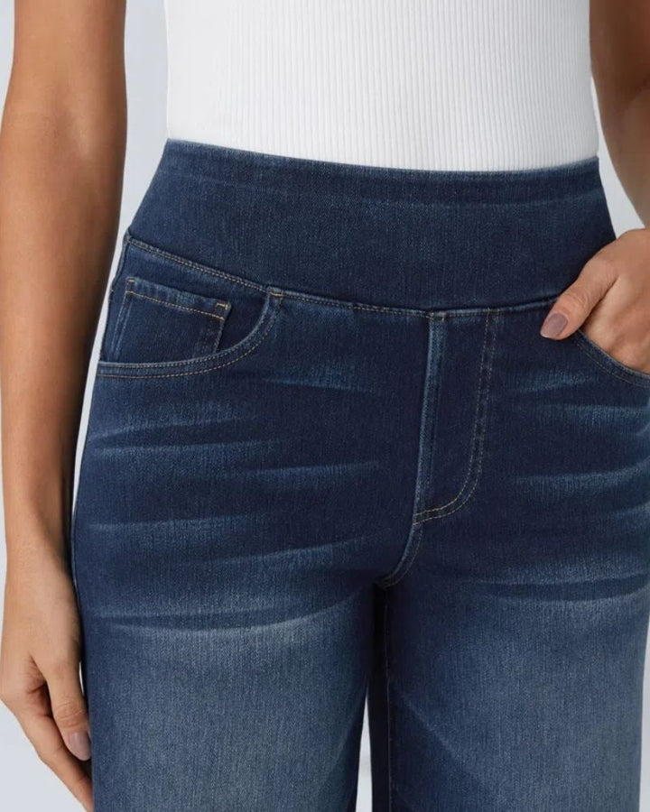 Close-up of button and zipper fly closure on women's comfort denim pants