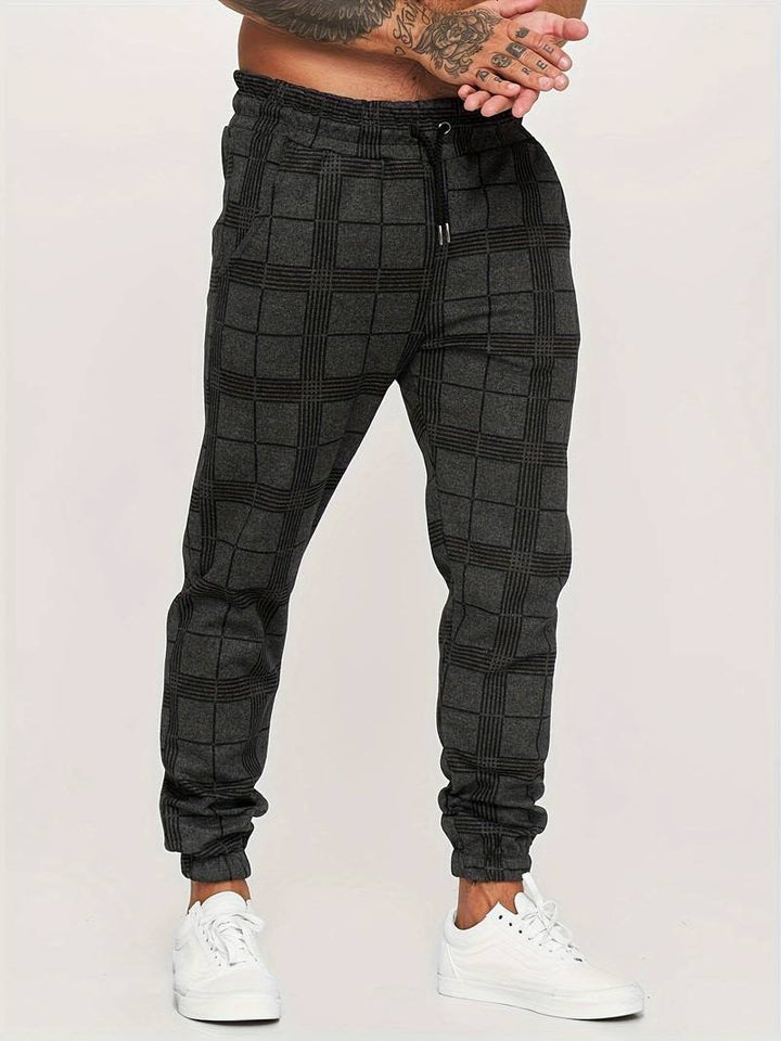 Men's fashion checked joggers styled for an active lifestyle and streetwear look.
