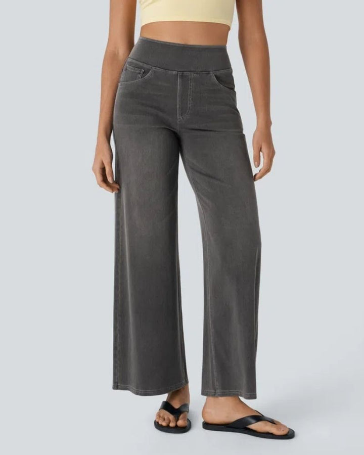 Full view of gray iron black wide-leg jeans styled with sandals