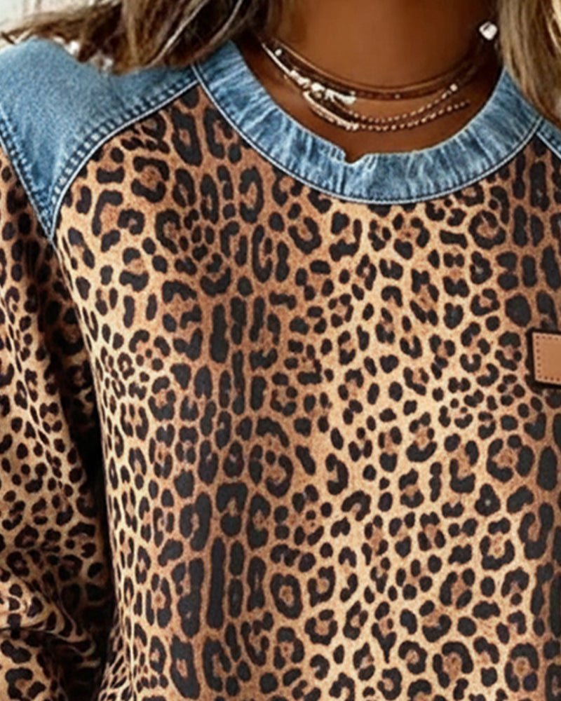 Close-up of the leopard print pattern and crew neckline