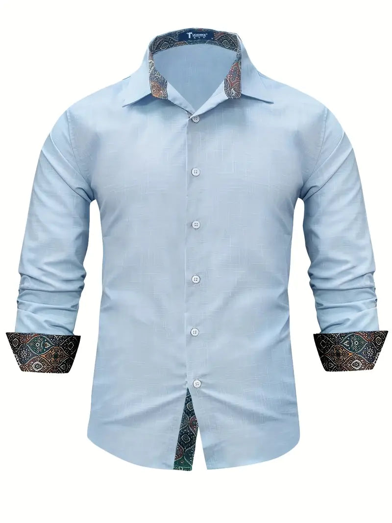 Flat lay of mens white button-up shirt paired with casual accessories