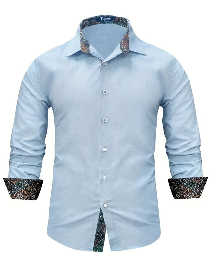 Flat lay of mens white button-up shirt paired with casual accessories