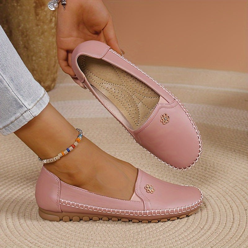 Back view of women's slip-on shoes displaying the reinforced heel counter and smooth collar finish.