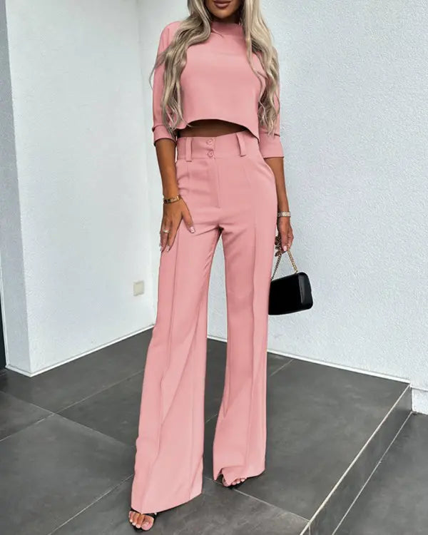 Flat lay of the trendy women clothing matching crop top and trousers