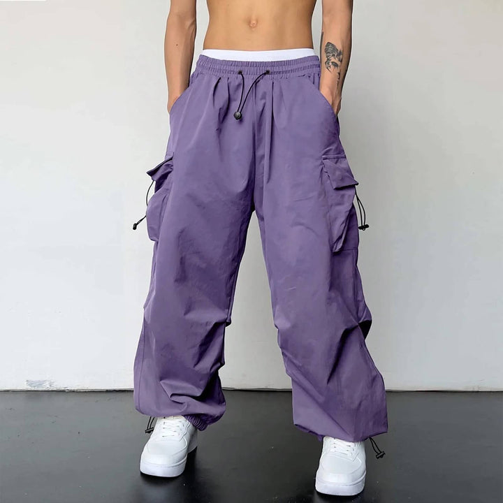 Utility trousers back pockets closeup with clean double-stitched seams