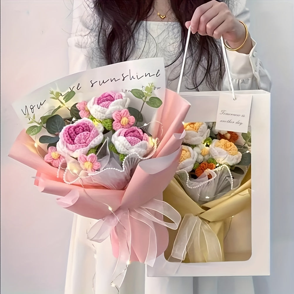 Woman holding a pink handmade crochet flower bouquet and a matching gift bag