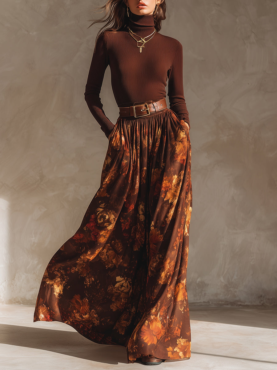 Woman wearing a brown turtleneck knitted top and a printed long skirt with a belt
