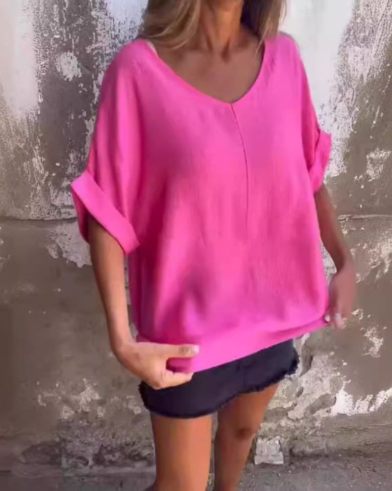 Back view of the women's casual V-neck t-shirt showing its relaxed fit and flowy hem.