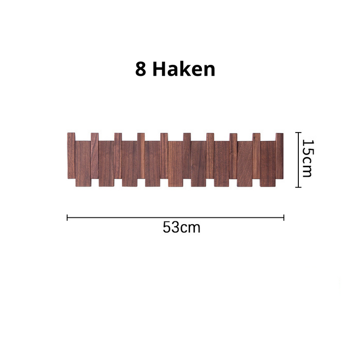 Adjustable wooden wall rack showing folding hooks and natural wood grain