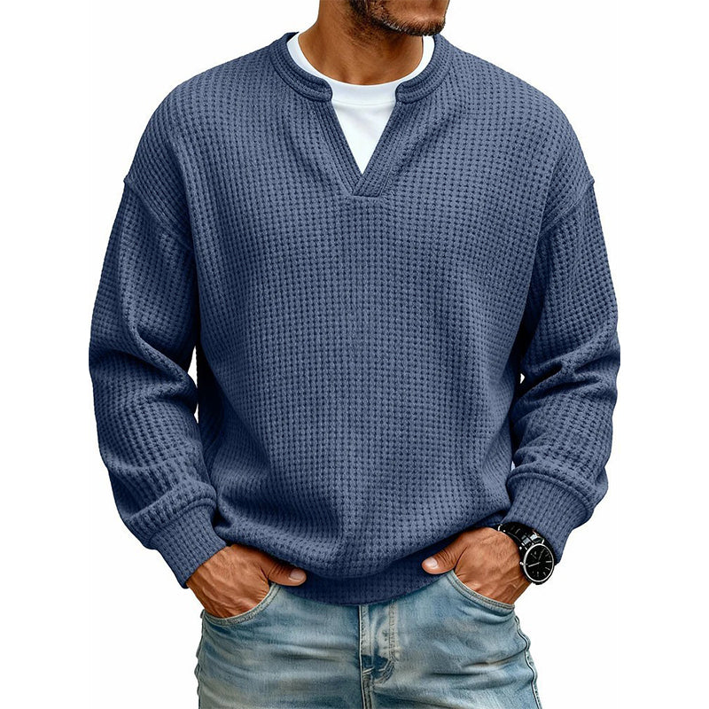 Close-up of textured waffle fabric on mens casual long sleeve shirt
