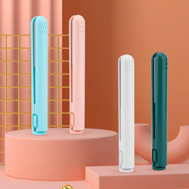 Compact travel hair styling irons showcased in bright pastel and dark green colours