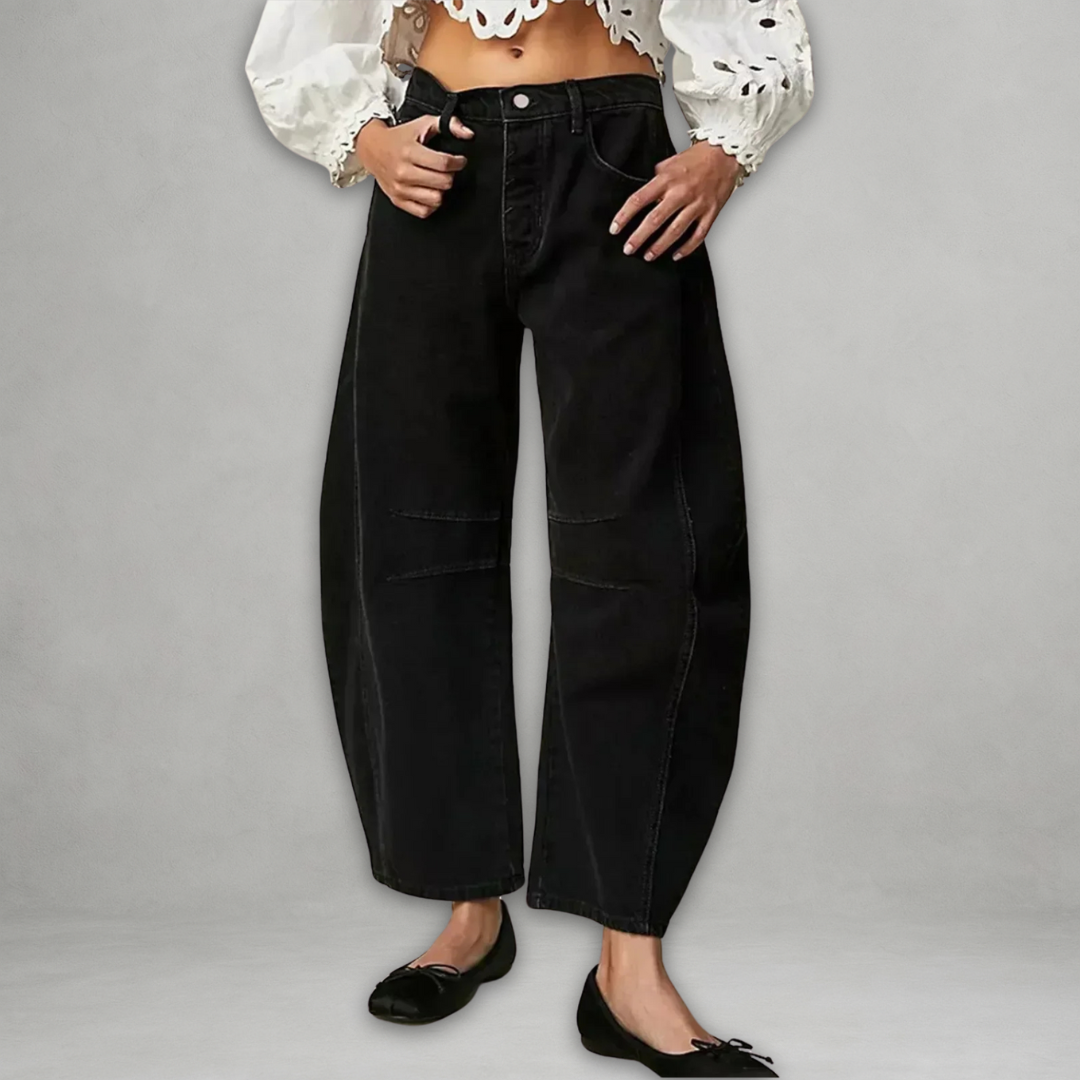 Close up fabric detail of womens casual trousers showcasing durable denim and high rise waistband