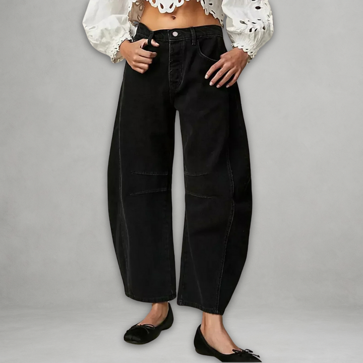 Close up fabric detail of womens casual trousers showcasing durable denim and high rise waistband