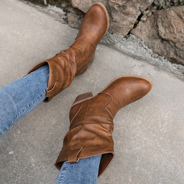 Side profile of women's comfortable mid-calf boots with sturdy block heel