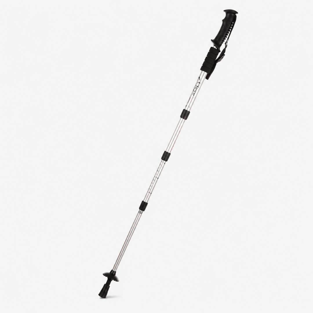 Close-up of the ergonomic grip and adjustable wrist strap on the hiking stick