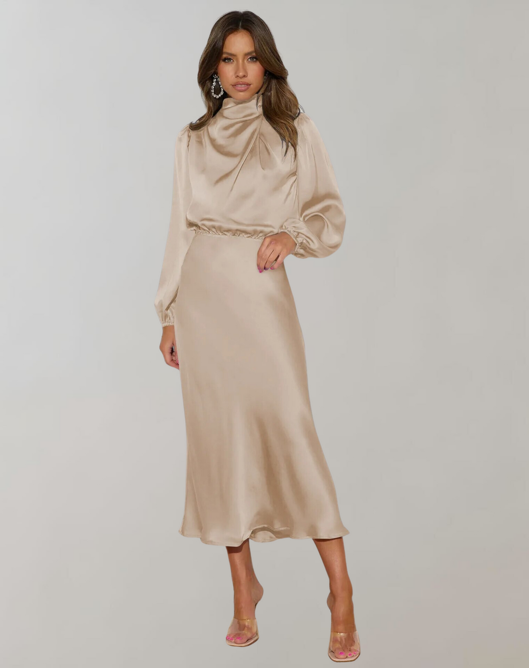 Model wearing beige long sleeved satin dress