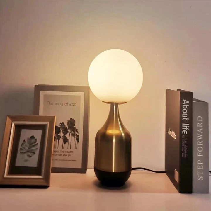Large Nordic Globe Table Lamp with metallic finish and spherical glass diffuser on a wooden surface
