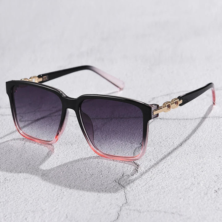 Close-up of fashionable square sunglasses for women with gradient lenses