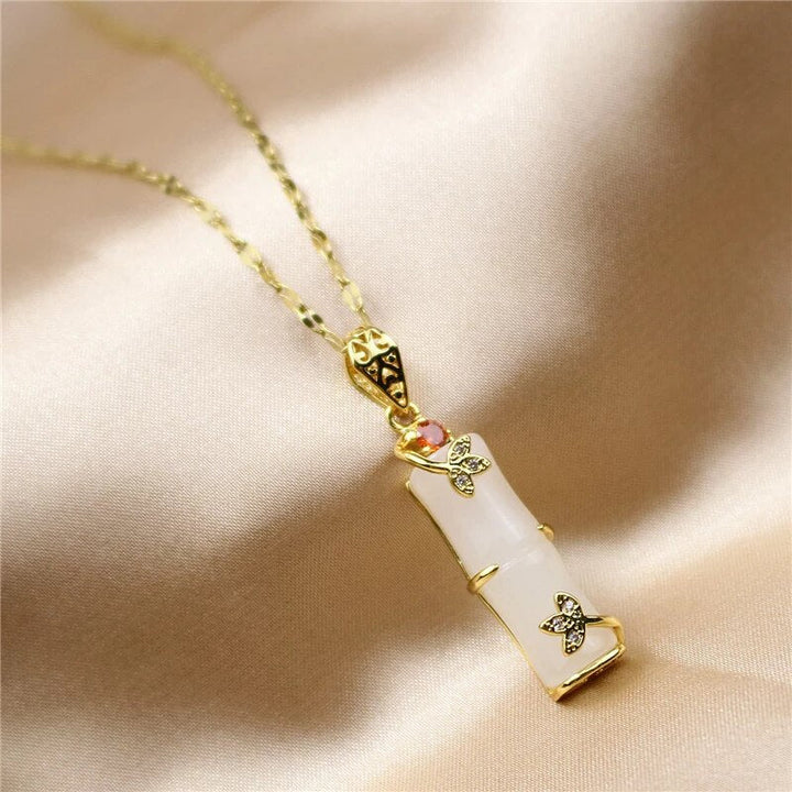 Handmade white jade amulet necklace showcasing a smooth natural stone for a unique minimalist jewelry look