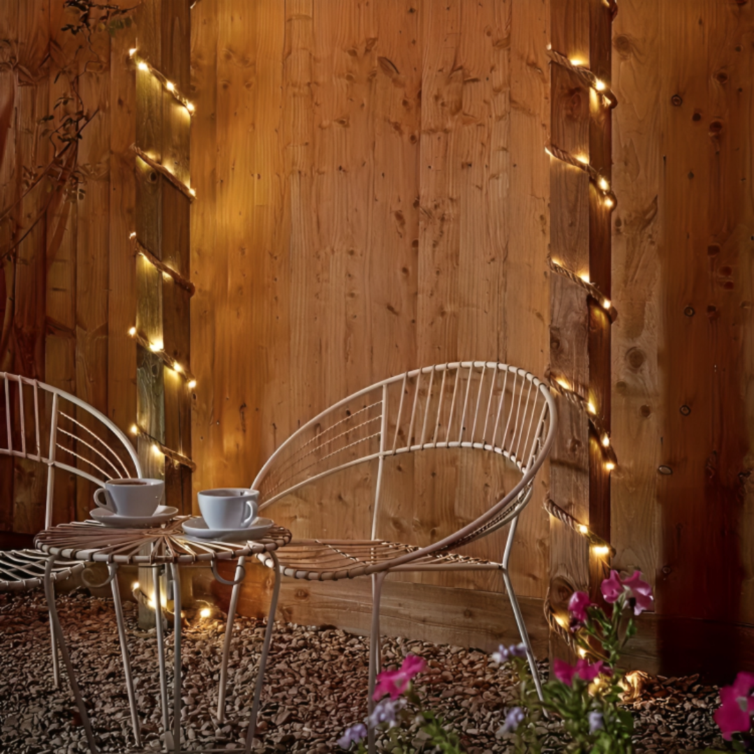 Solar LED rope string lights illuminating a cozy outdoor patio at night