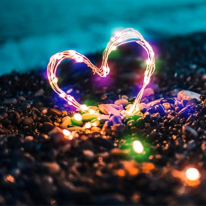 Close-up of waterproof LED fairy lights glowing warmly for outdoor decor