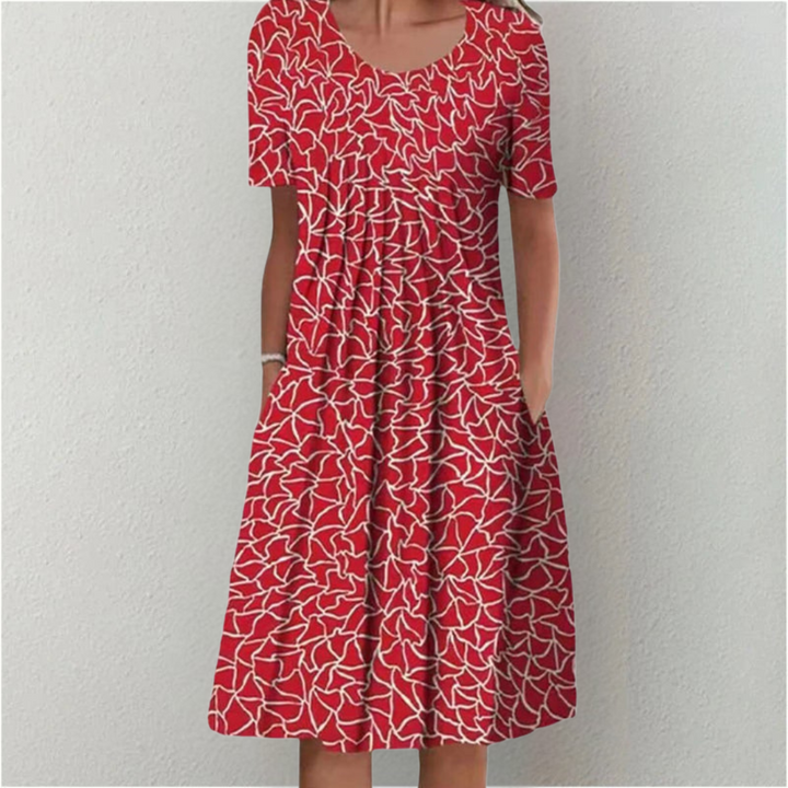 Trendy summer floral dress with a graceful midi silhouette and short sleeves.