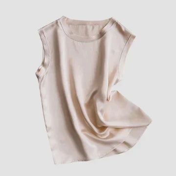 Beige sleeveless satin top showcasing its soft draped fabric