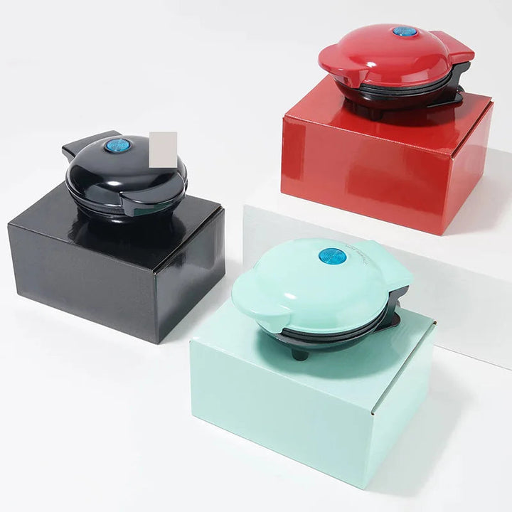 Mini waffle iron open and ready for batter in a modern kitchen setting
