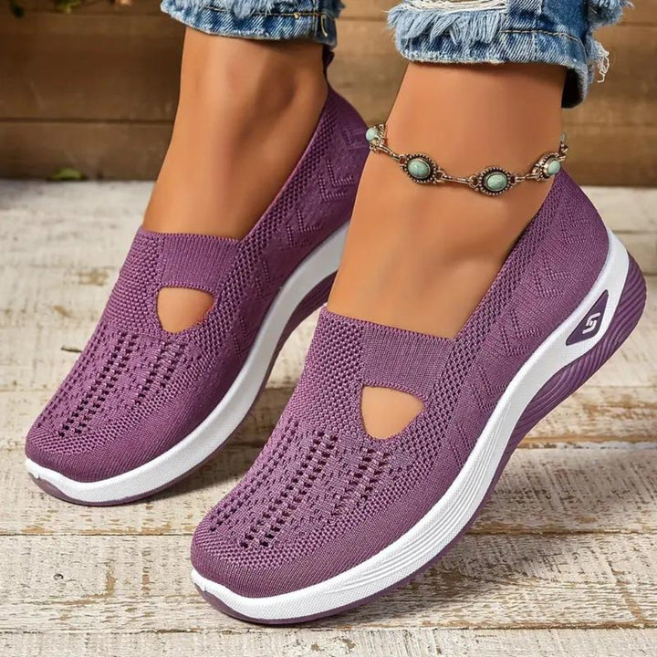 Side angle of women's orthopedic walking sneakers with arch support and breathable mesh