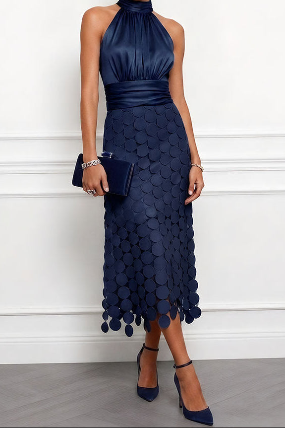 Back view of the elegant halter neckline party dress showcasing clean tailoring.