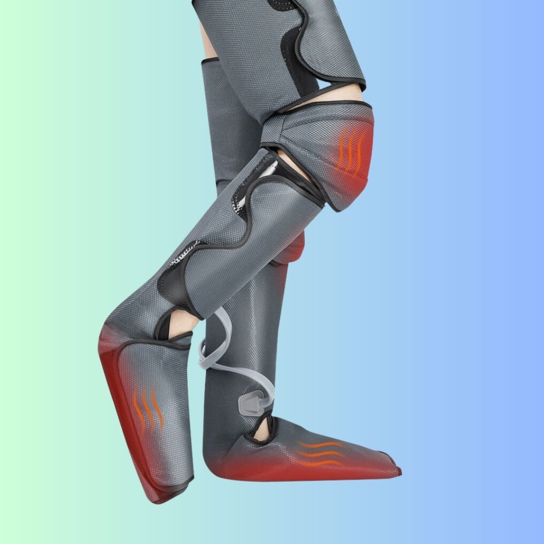 Person wearing grey full leg massage sleeves with heat visualization