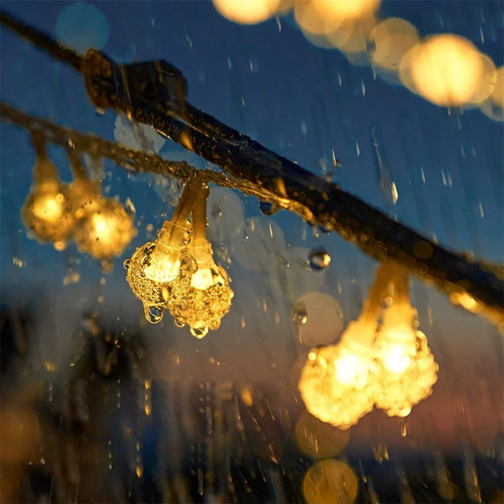 Eco friendly solar powered garden lighting with glowing round bulbs on display