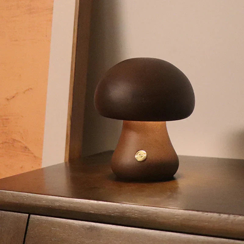 Dark wooden mushroom-shaped LED night light in walnut finish on a dark surface