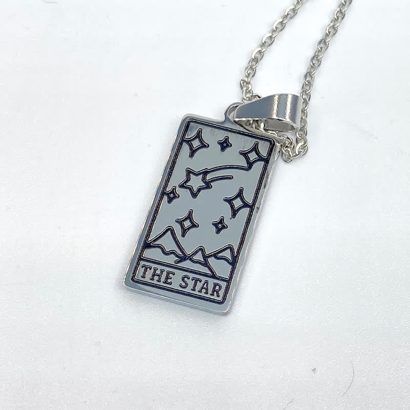 Silver vintage luck charm necklace featuring tarot card design